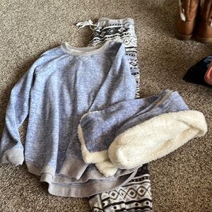 Full pajama set. Includes pants, sweater, and scarf.